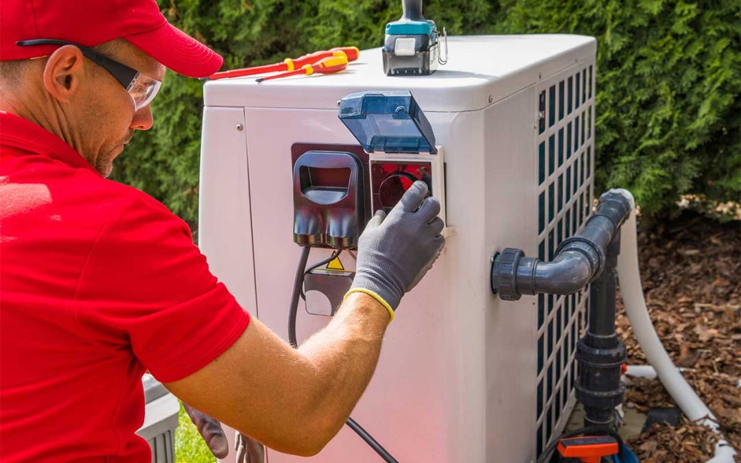 Technician performing pool chiller maintenance
