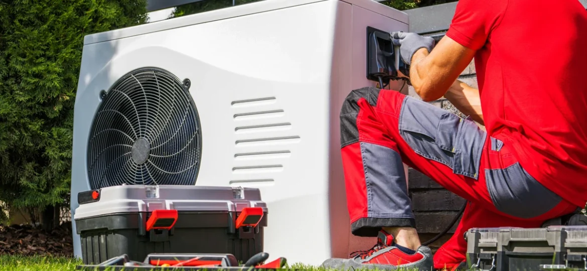 Technician performing pool heater maintenance