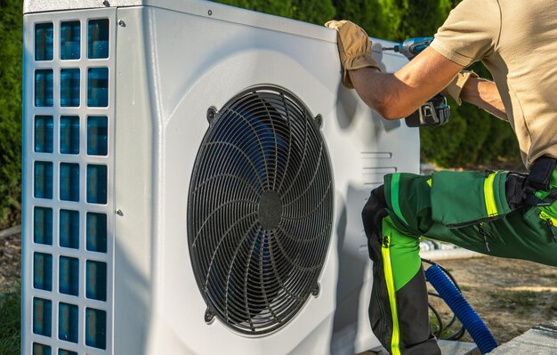 Technician performing heater and chiller maintenance